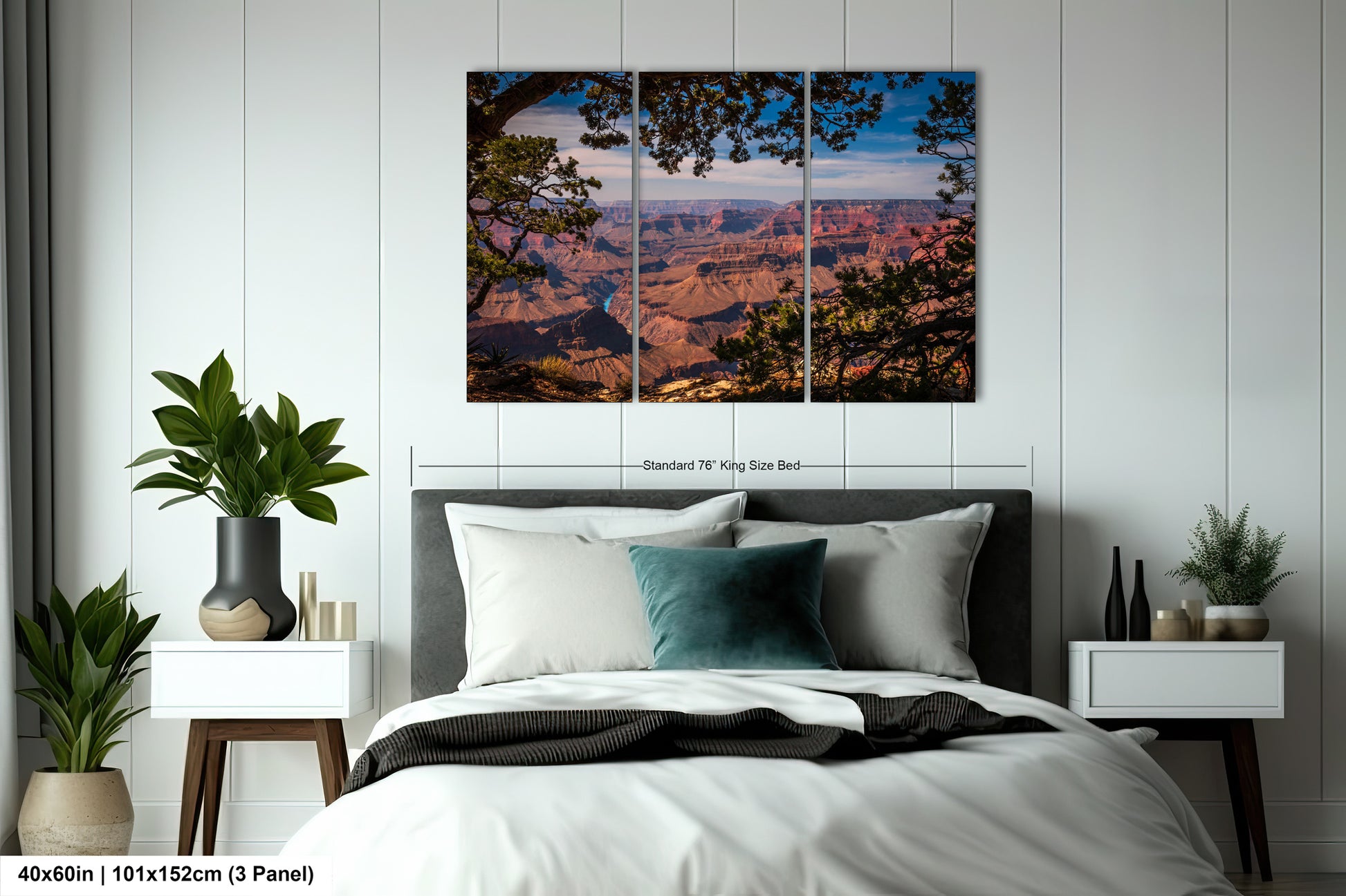 a bedroom with a bed and two paintings on the wall