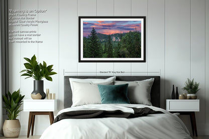 a bedroom with a bed and a picture hanging on the wall