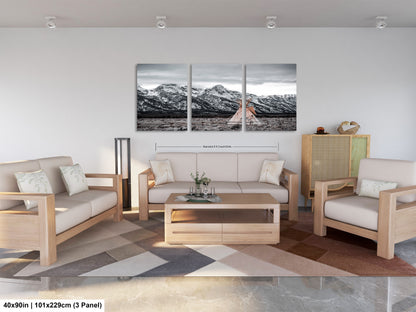 a living room filled with furniture and a painting on the wall