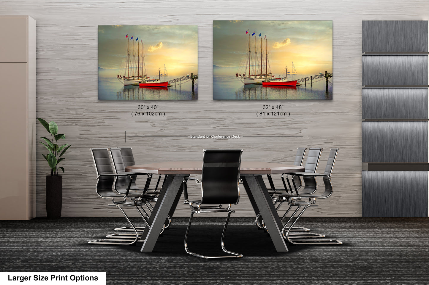 a dining room table with chairs and two pictures of boats on the wall
