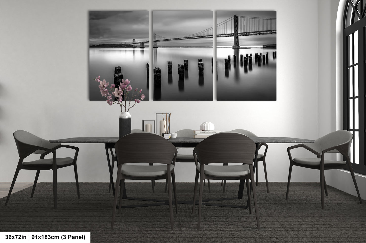 a black and white photo of a dining room table