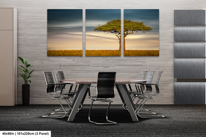 a dining room table with chairs and a painting on the wall