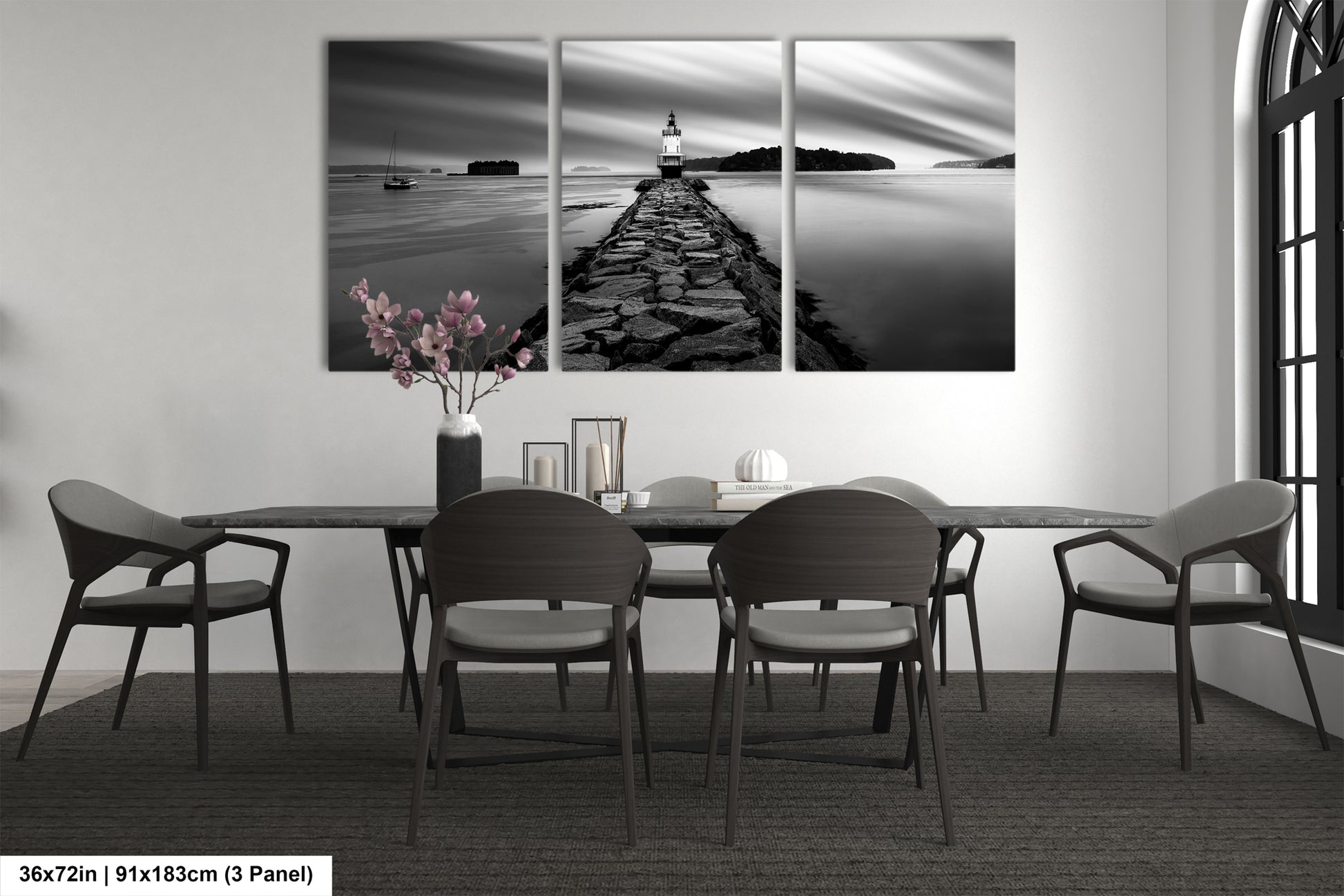 a black and white photo of a table and chairs