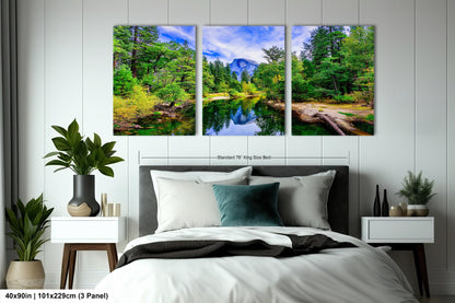 a bedroom with a bed and three paintings on the wall