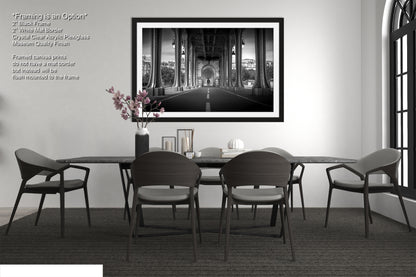 a black and white photo of a dining room