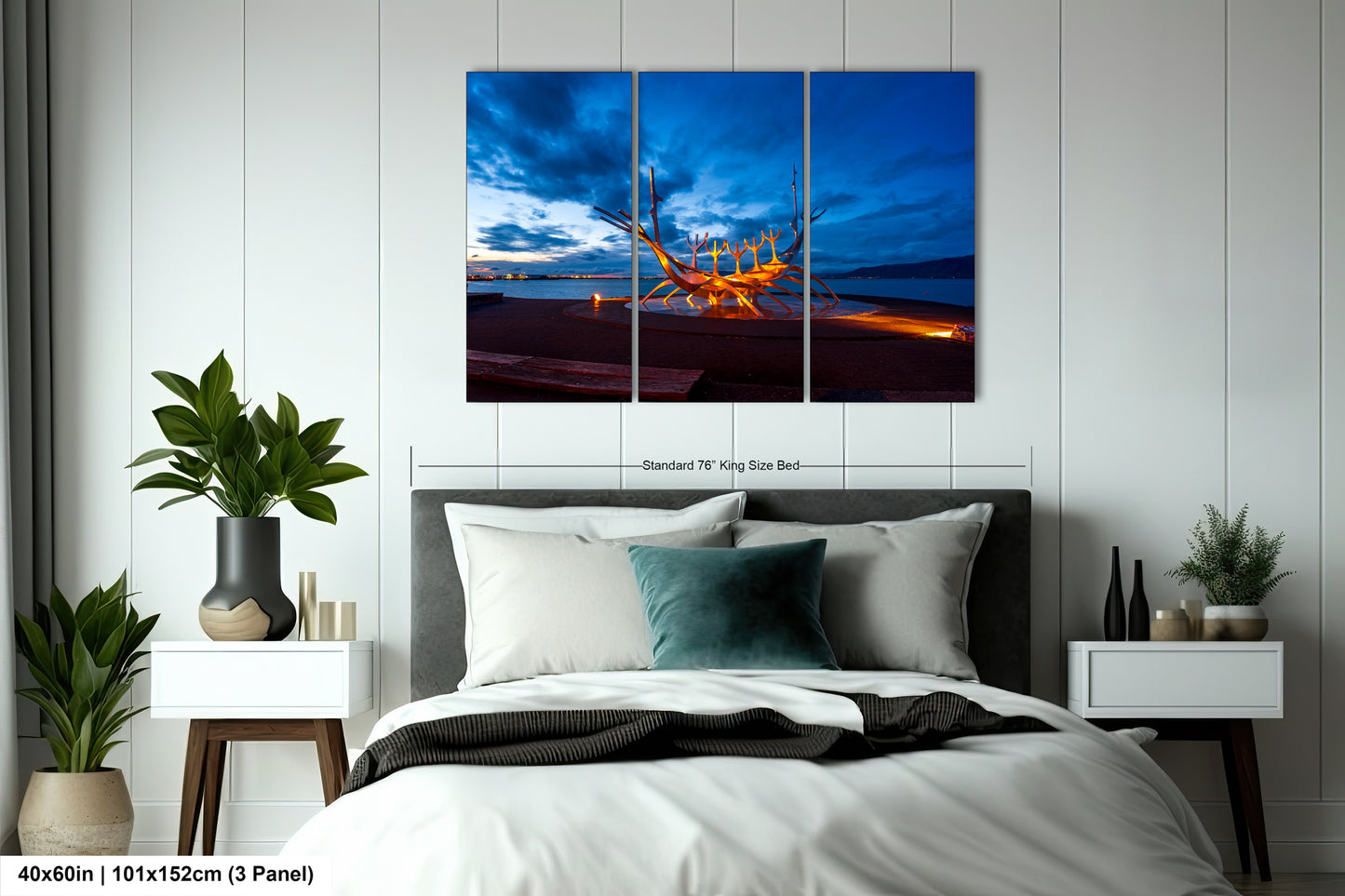 a bed room with a neatly made bed and a painting on the wall