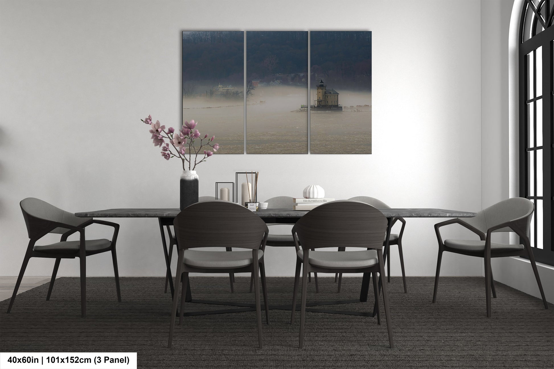 a dining table with four chairs and a vase of flowers