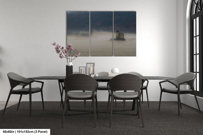 a dining table with four chairs and a vase of flowers