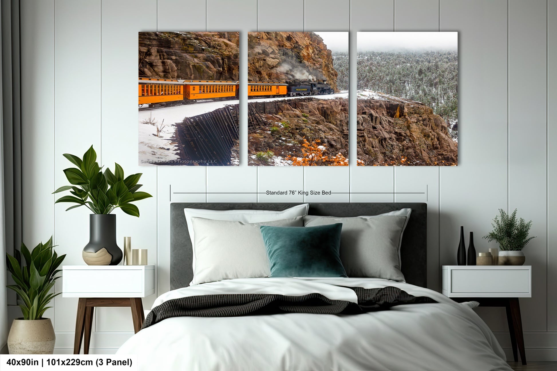 a bed room with a neatly made bed and two pictures on the wall