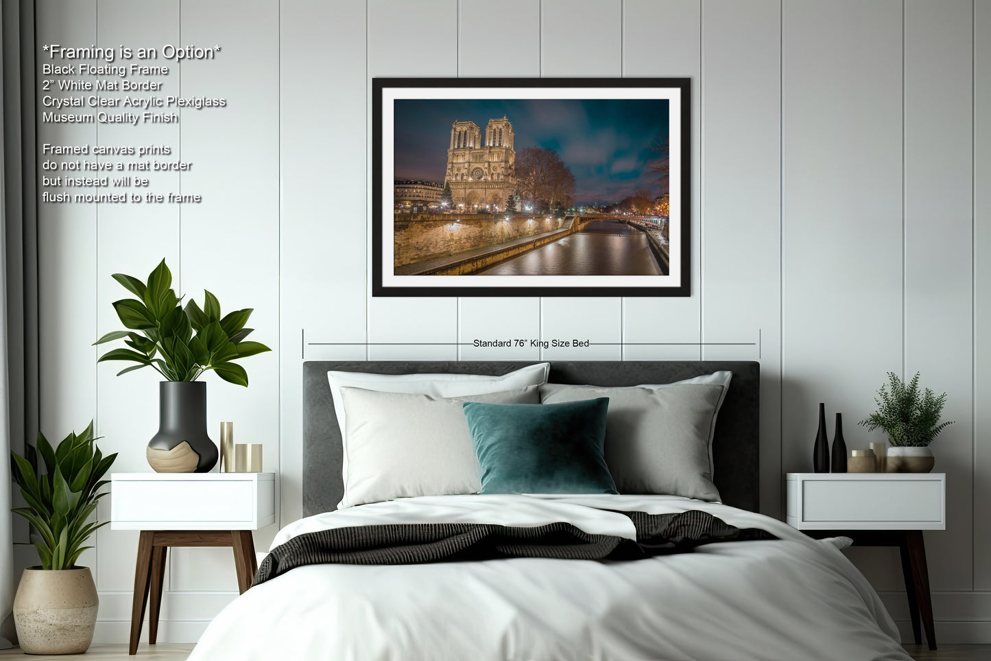 a bedroom with a large bed and a picture hanging on the wall