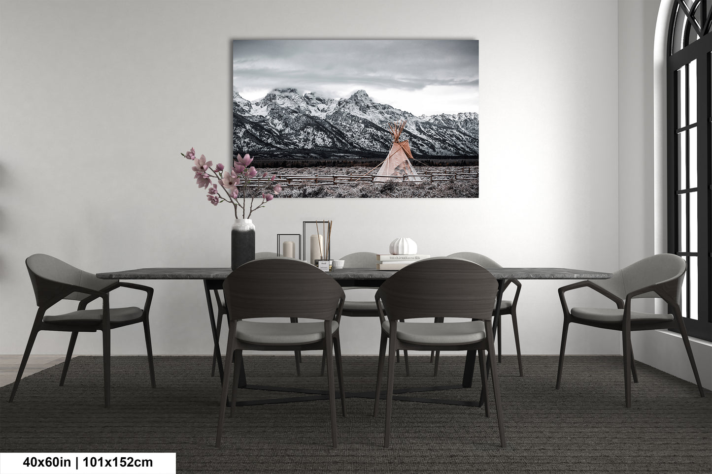 a black and white photo of a dining room table