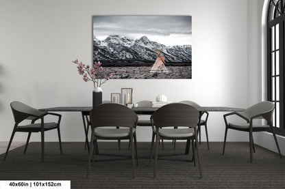 a black and white photo of a dining room table