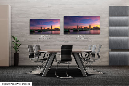 a dining room table with a view of a city at sunset