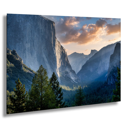 a view of a valley with mountains in the background