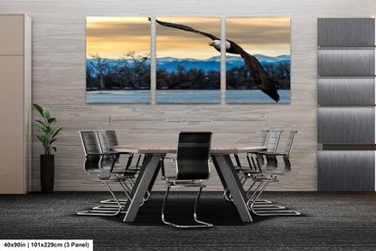 a large bird flying over a table with chairs