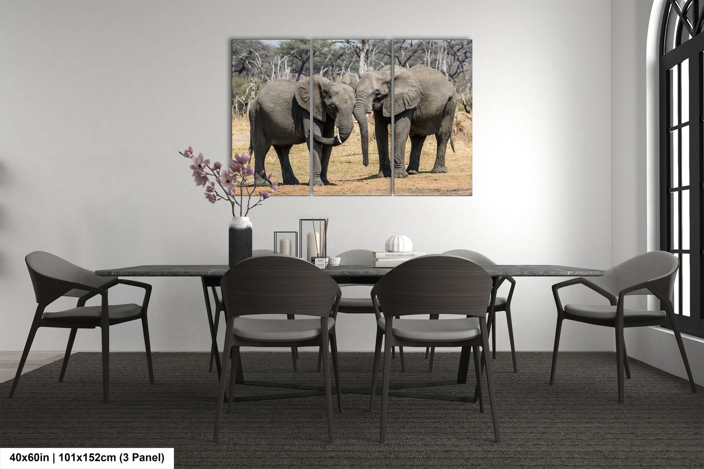 a couple of elephants standing next to each other