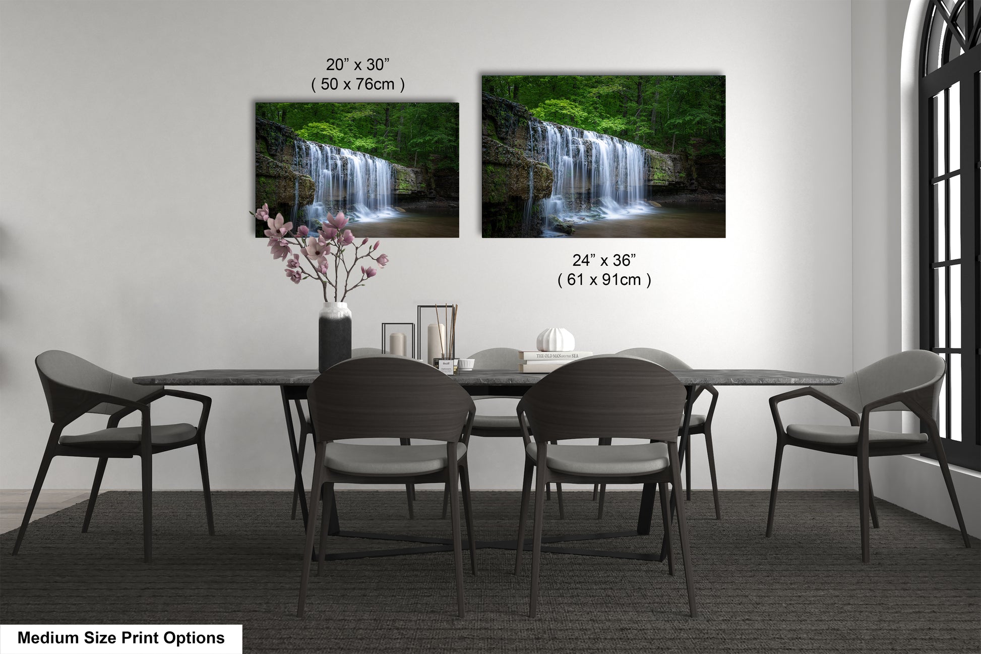 a dining room table with four chairs and a vase of flowers