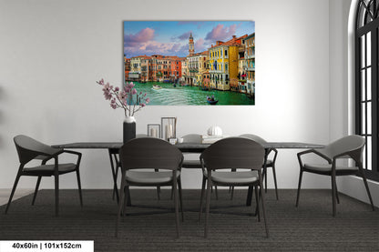 a dining room table with chairs and a painting on the wall