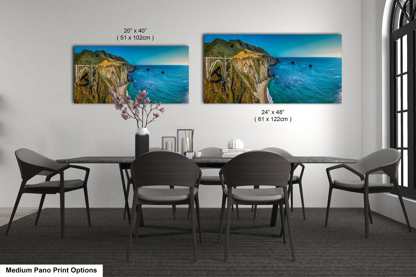 a dining room table with four chairs and a painting on the wall