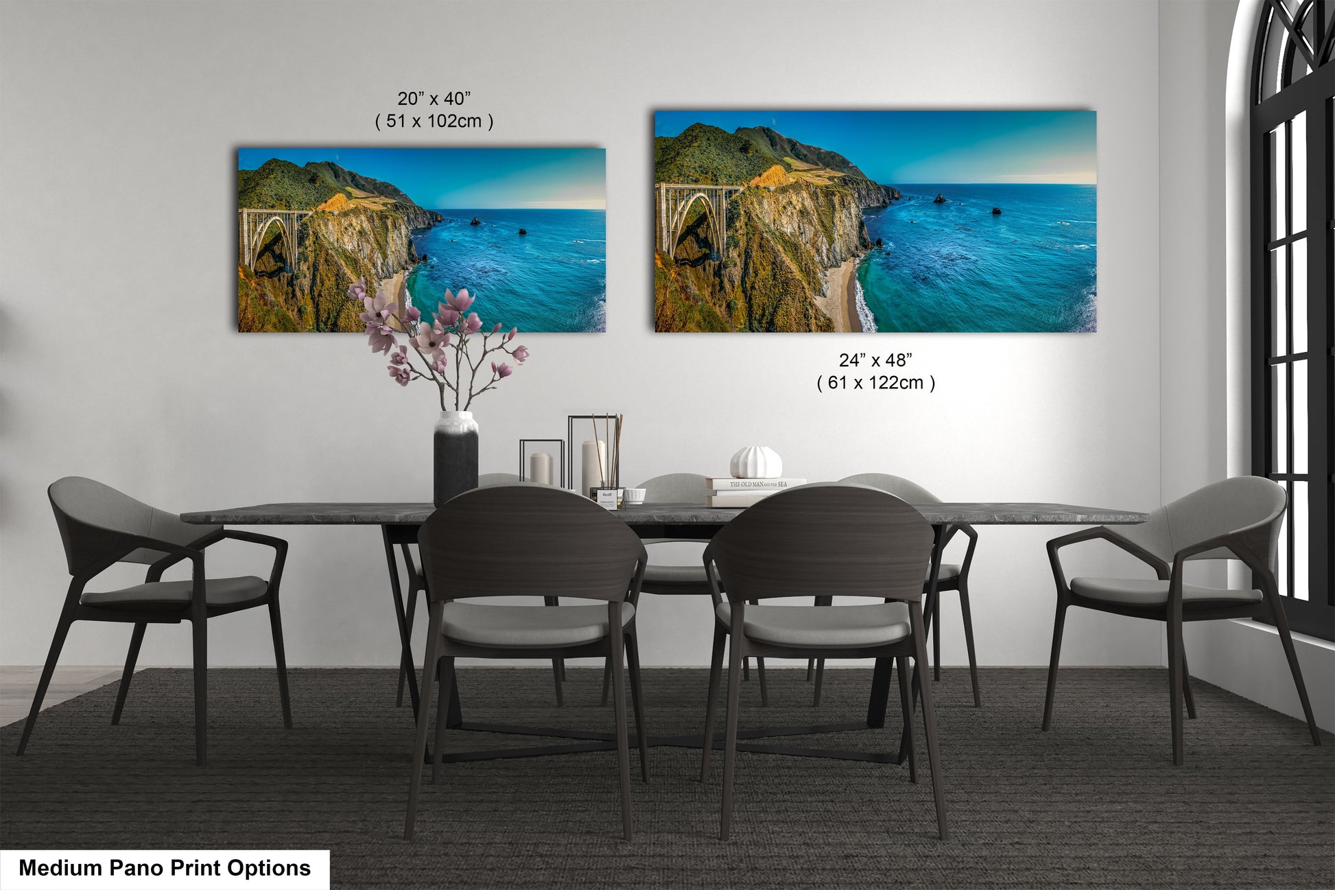 a dining room table with four chairs and a painting on the wall