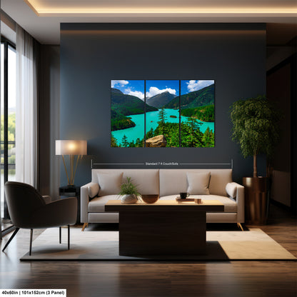 a modern living room with a large, high-resolution landscape painting hanging on the wall. The painting features a serene mountain scene with a turquoise lake and lush green forests. The room is furnished with a white sofa, a wooden coffee table, and a potted plant, creating a cozy and inviting atmosphere.