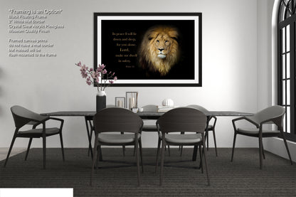 a dining room table with chairs and a framed picture of a lion
