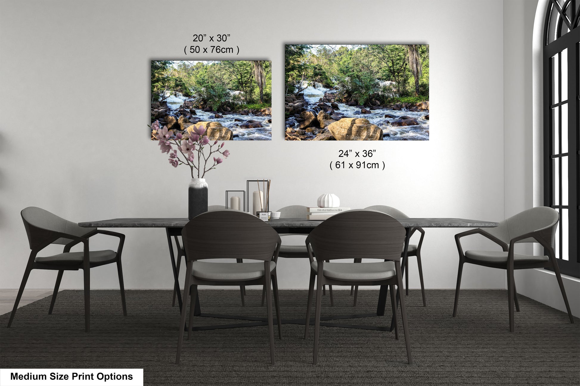 a dining room table with four chairs and a vase of flowers