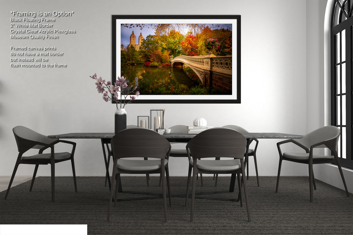 a bedroom with a large bed, a nightstand, and a framed picture of a bridge with autumn foliage.