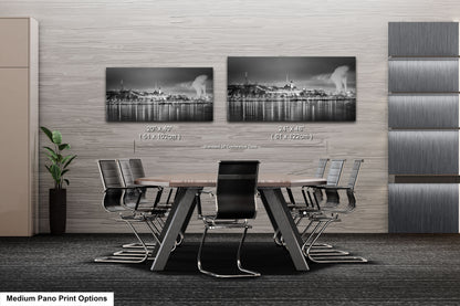a black and white photo of a table and chairs
