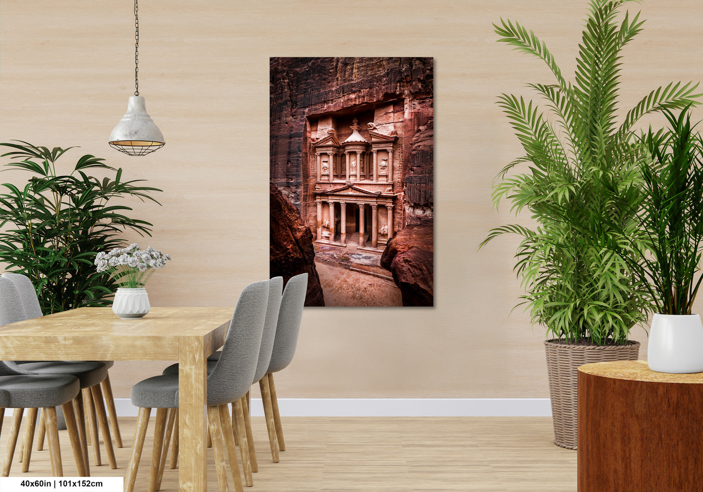 a room with a table and chairs and a painting on the wall