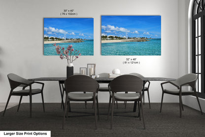 a dining room table with chairs and a vase of flowers