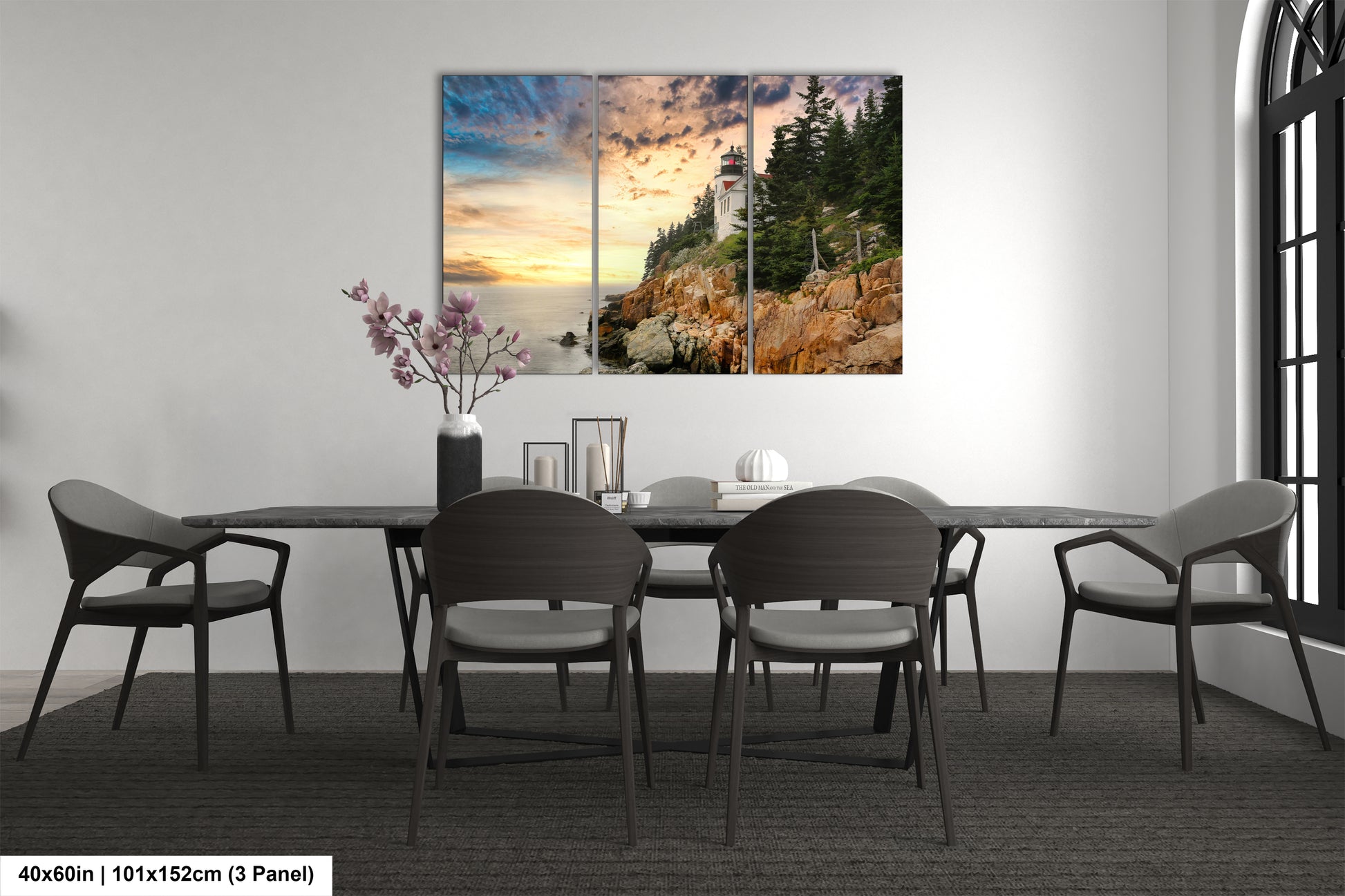 a dining room table with chairs and a painting on the wall