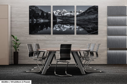 a black and white photo of a table and chairs