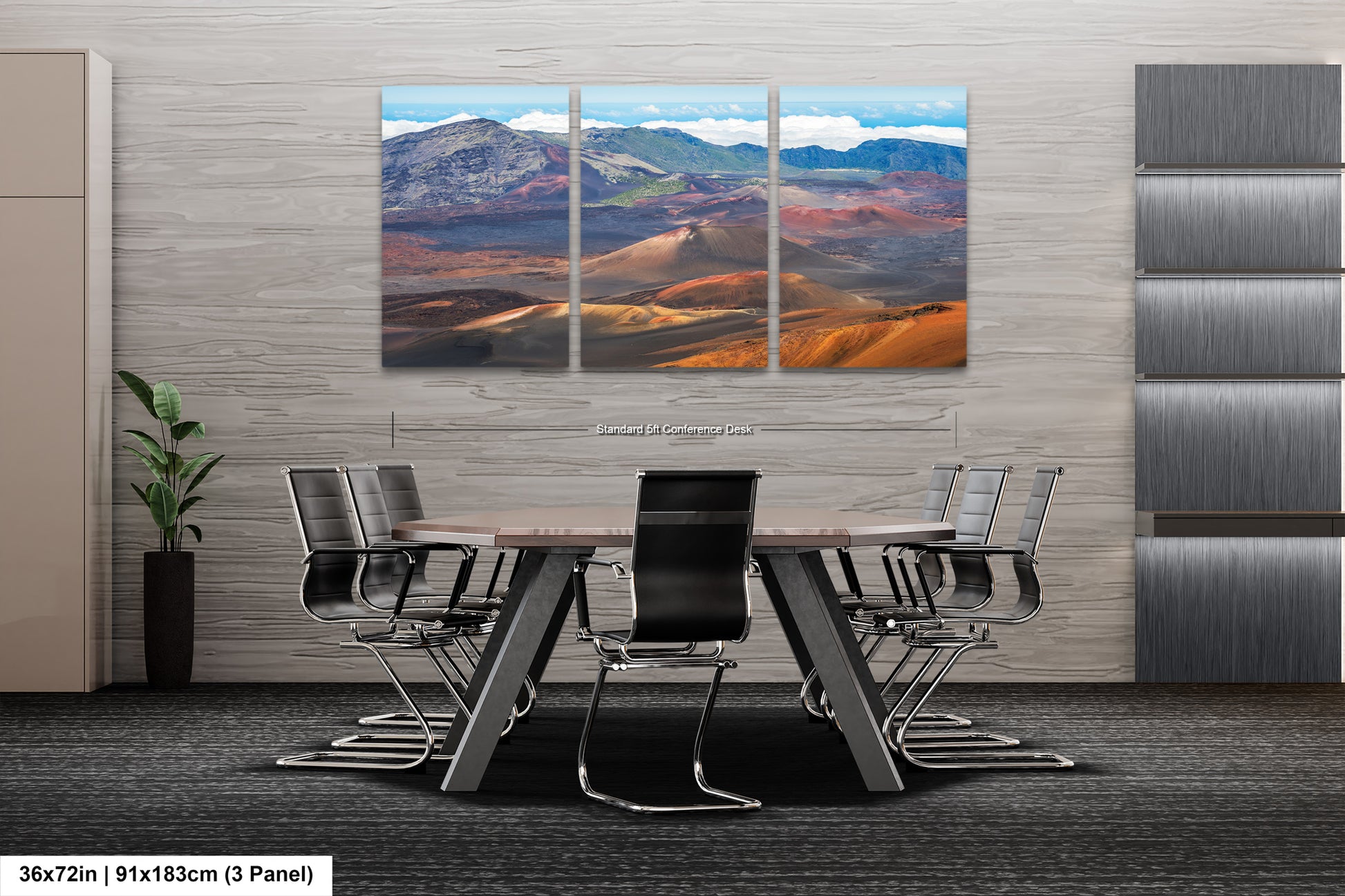 A modern office space with a large, three-panel landscape painting of a desert mountain range hanging on the wall. The painting features a variety of colors and textures, creating a striking visual focal point. The office space includes a wooden table surrounded by black chairs, and a plant in a vase on the left side of the room.