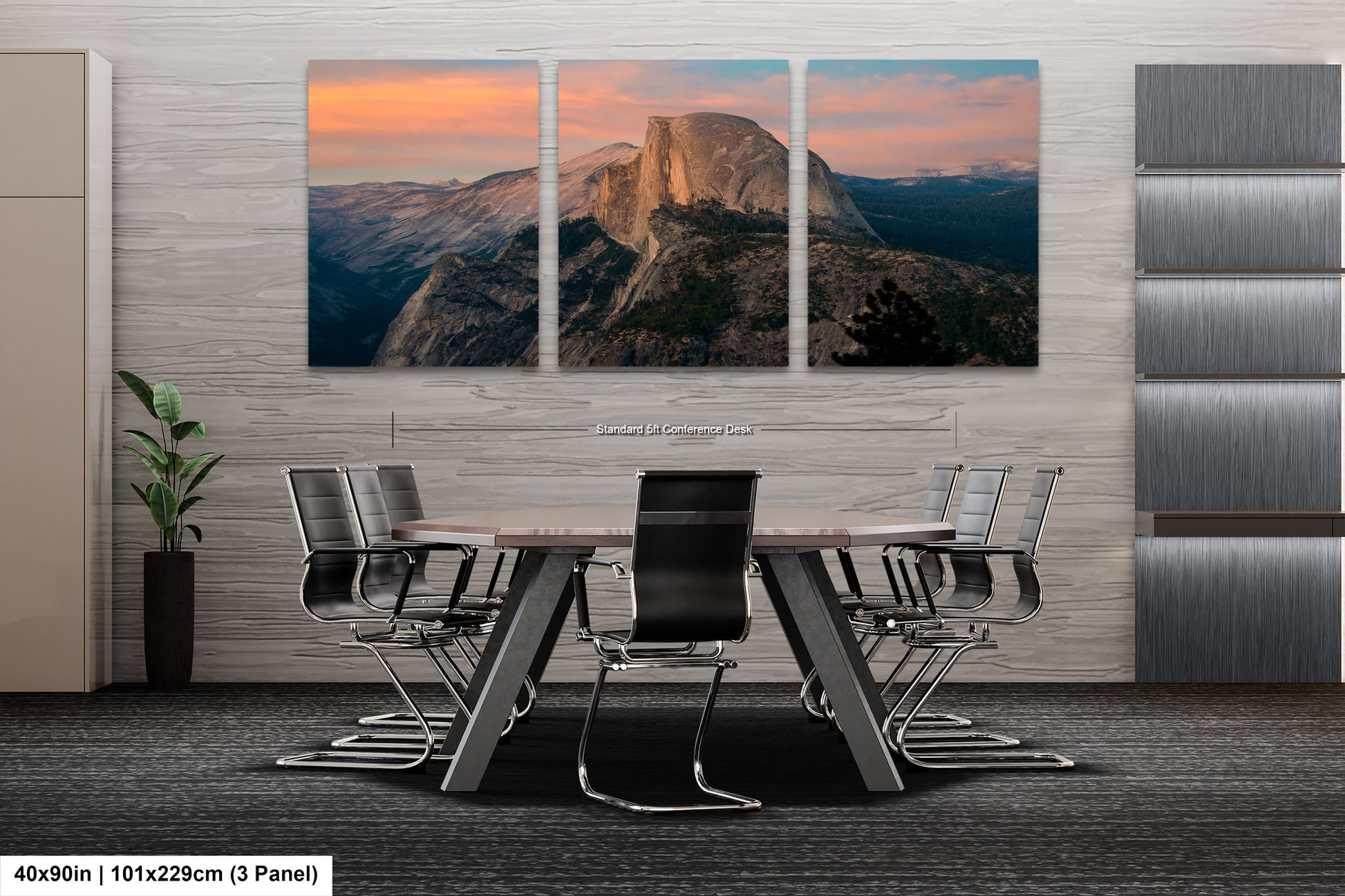 a dining room table with chairs and a mountain in the background