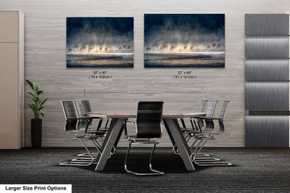 a room with a table and chairs and two pictures of a waterfall