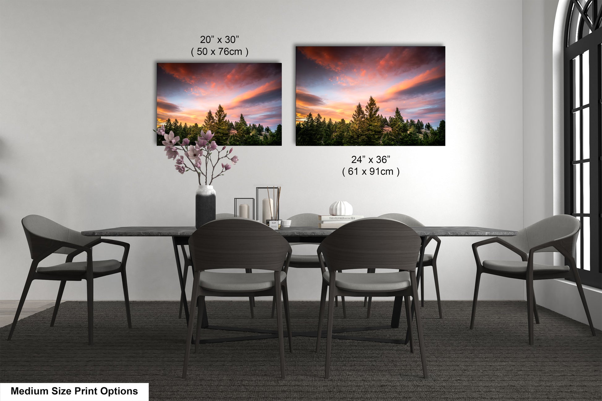 a dining table with four chairs and a vase of flowers