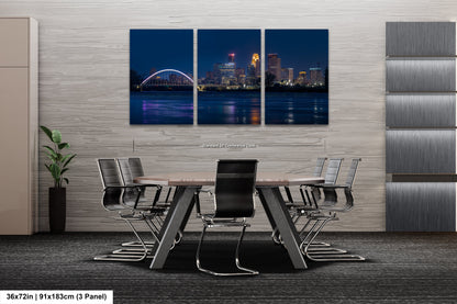 a dining room table with a view of a city at night