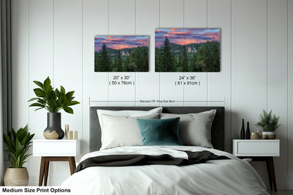 a bed room with a neatly made bed and two pictures on the wall