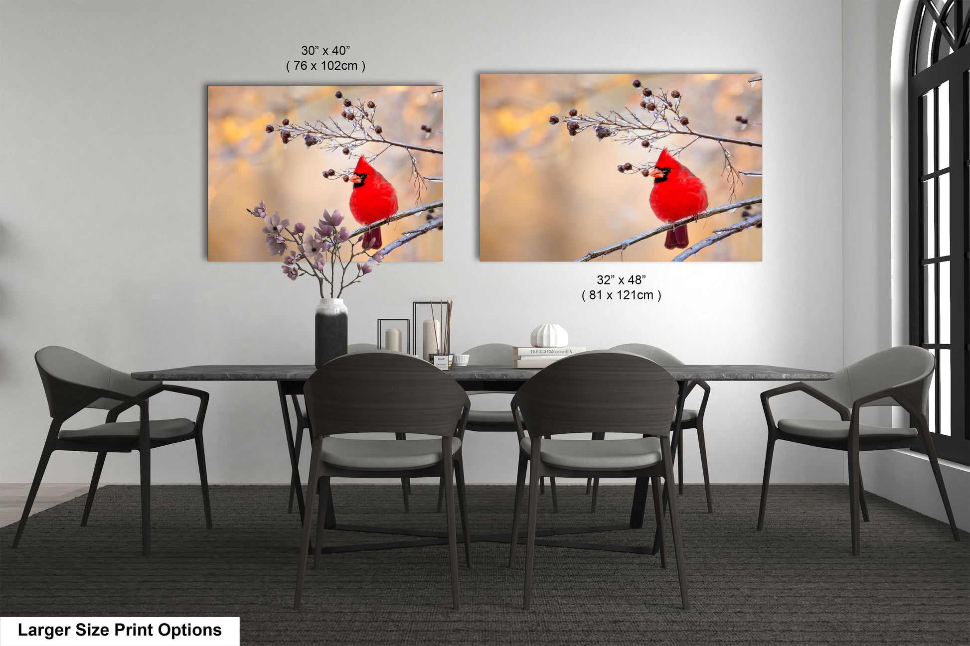 a dining room table with chairs and a painting of a cardinal on it