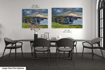a dining room table with four chairs and a vase of flowers
