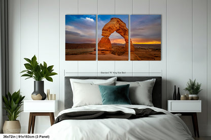 a bed room with a neatly made bed and two pictures on the wall