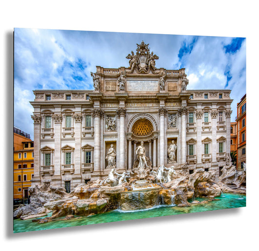 a large building with a fountain in front of it