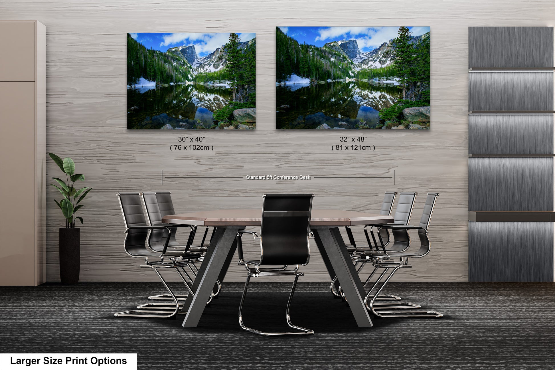 a dining room table with chairs in front of two pictures of mountains
