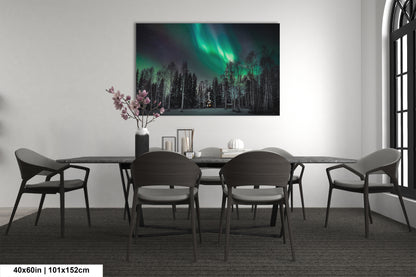 a room with a table and chairs and a painting on the wall