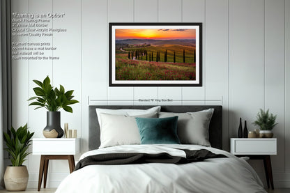 a bedroom with a large bed and a picture on the wall