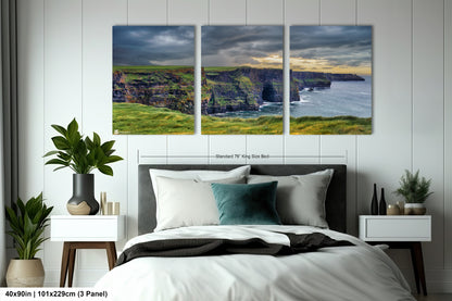 a bedroom with a bed and two paintings on the wall