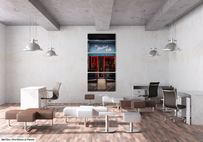 a room filled with lots of white chairs and desks