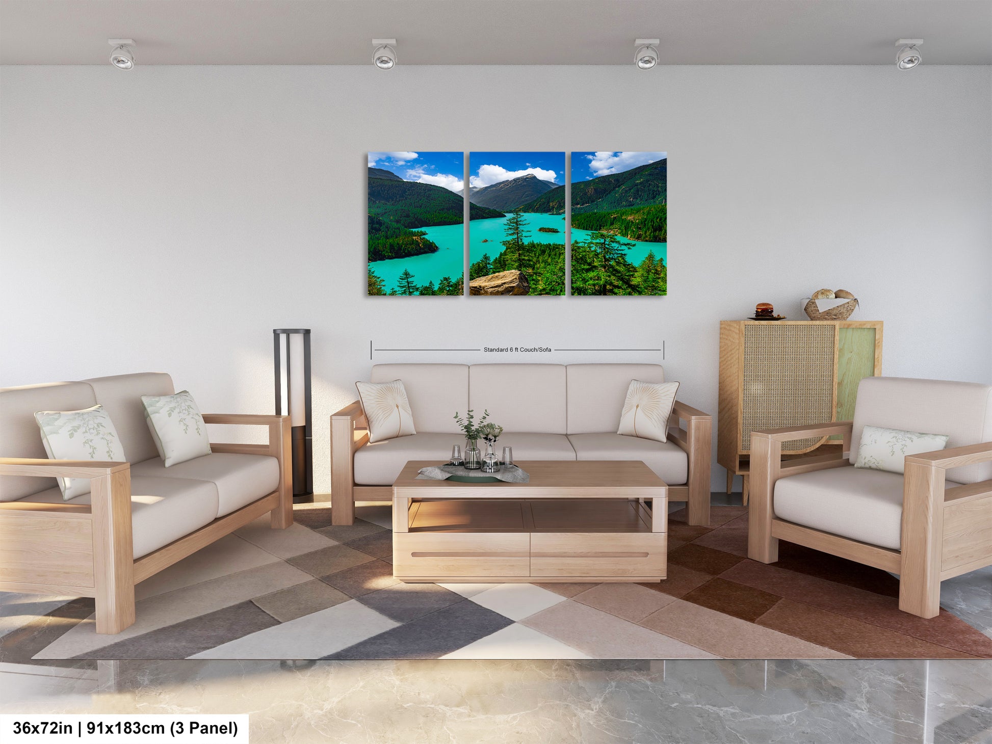 The image is a modern living room with a large, three-panel landscape painting hanging on the wall. The painting depicts a scenic mountain landscape with a turquoise lake and lush green forests. The room is furnished with a sofa, two armchairs, and a coffee table, creating a comfortable and inviting atmosphere.