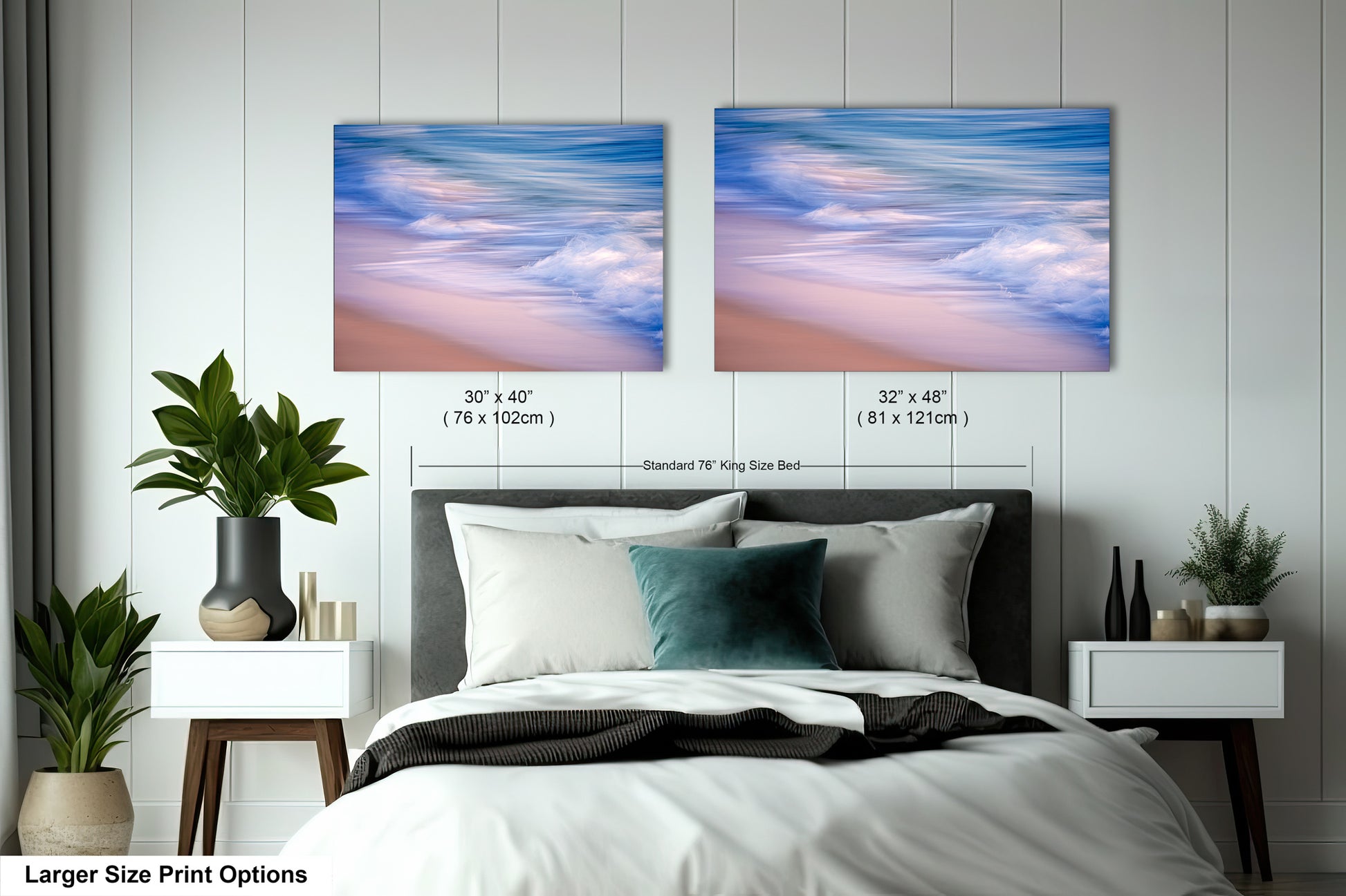 a bed with a white comforter and two pictures on the wall above it
